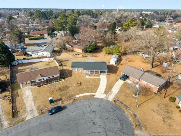 an aerial view of a house with a snow