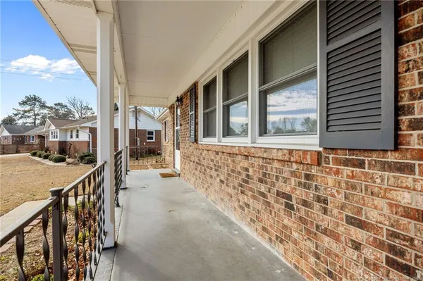 a view of a brick house with a street