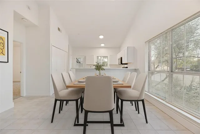 a view of a dining room with furniture window and outside view