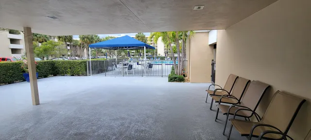 a dining room with furniture window and garden view