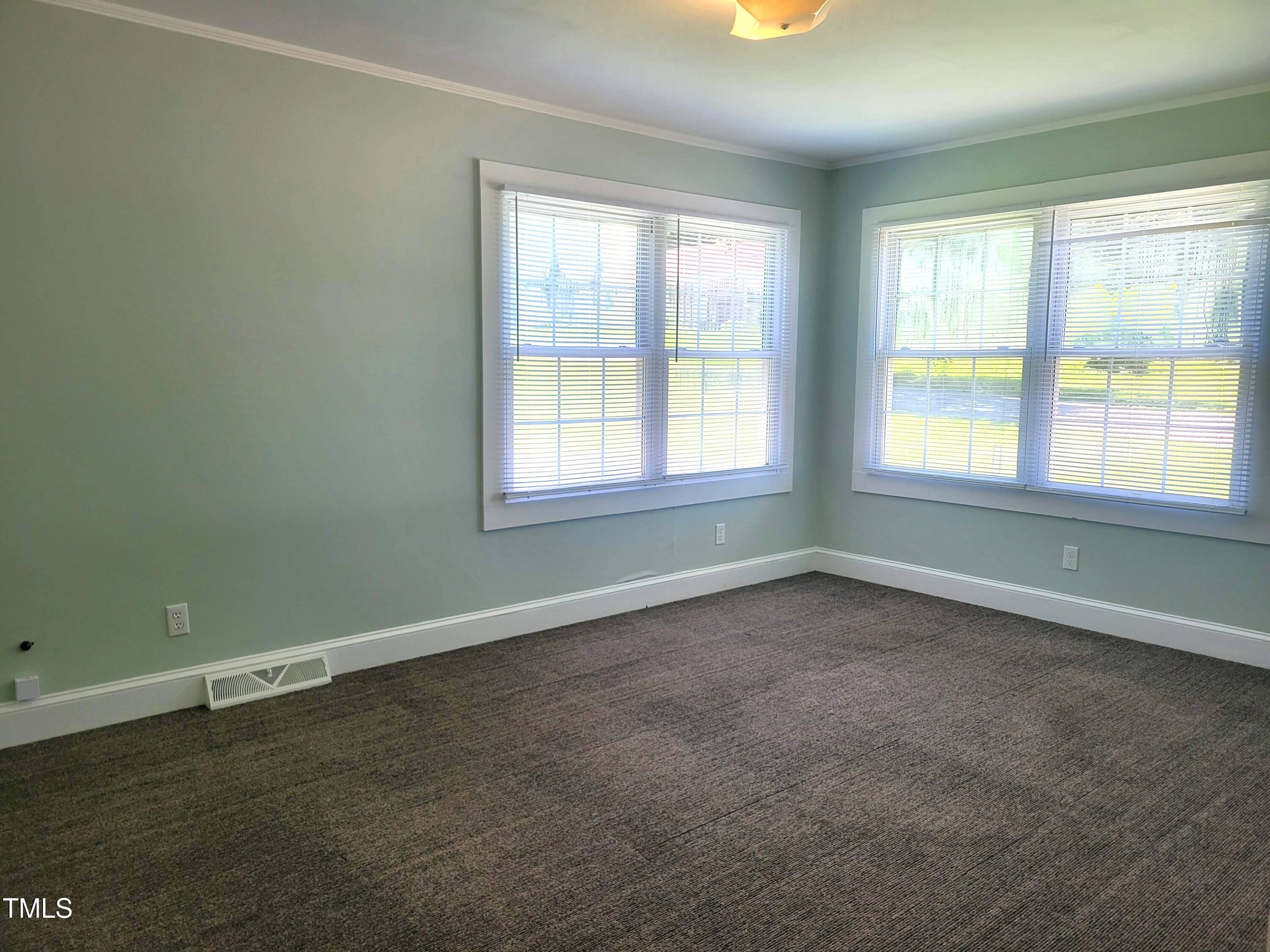411 West Raleigh Street Siler City, NC 27344 - Photo 16 of 33 an empty room with a window