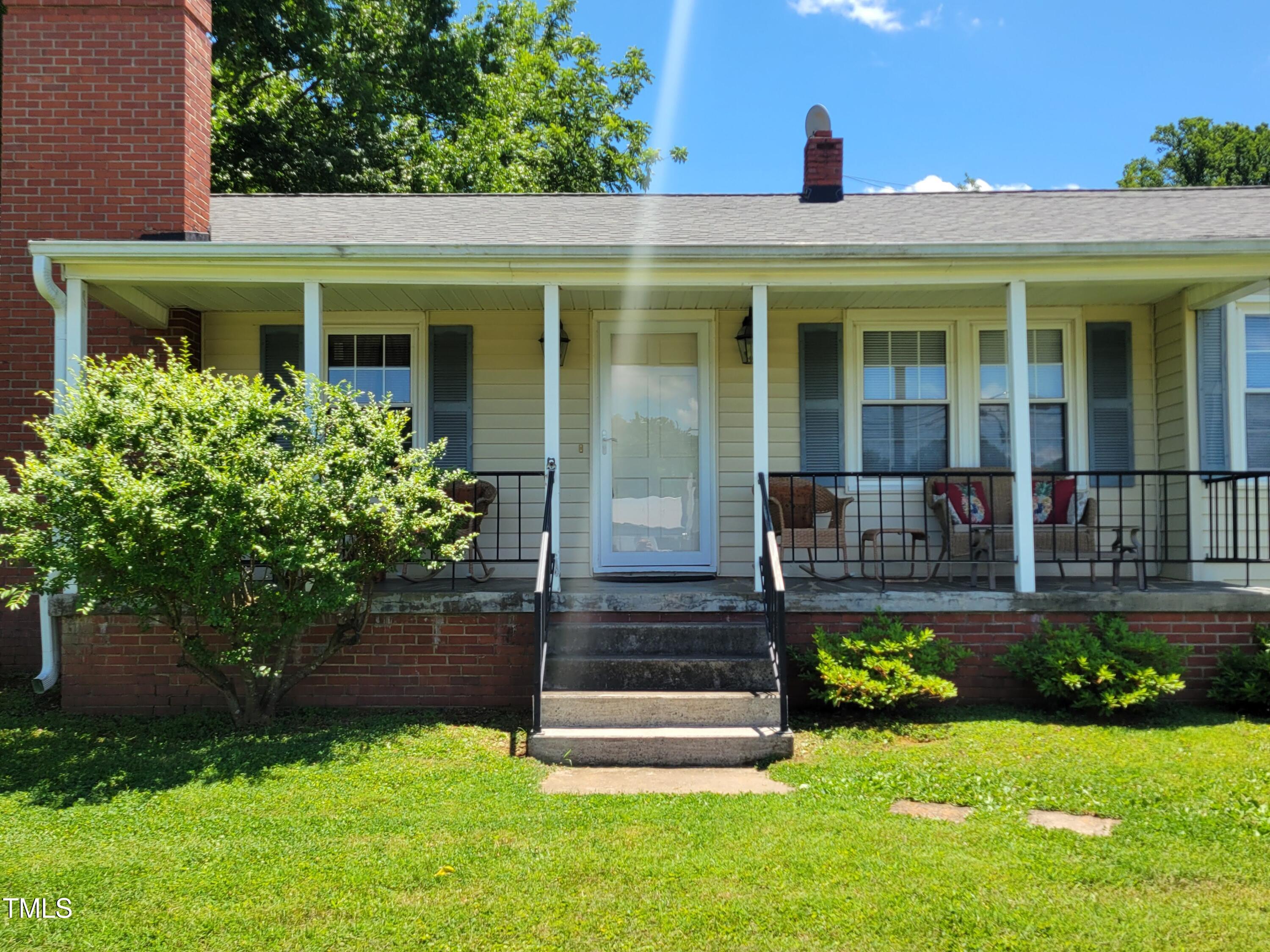 411 West Raleigh Street Siler City, NC 27344 - Photo 2 of 33 a front view of a house with a yard
