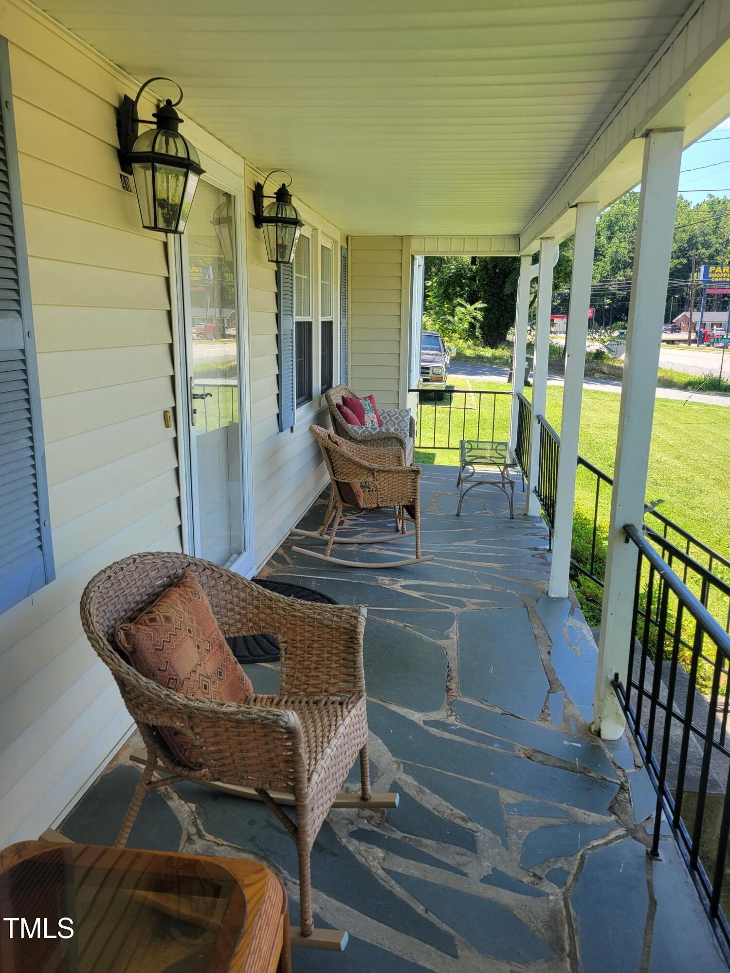 411 West Raleigh Street Siler City, NC 27344 - Photo 25 of 33 a living room with furniture and a floor to ceiling window