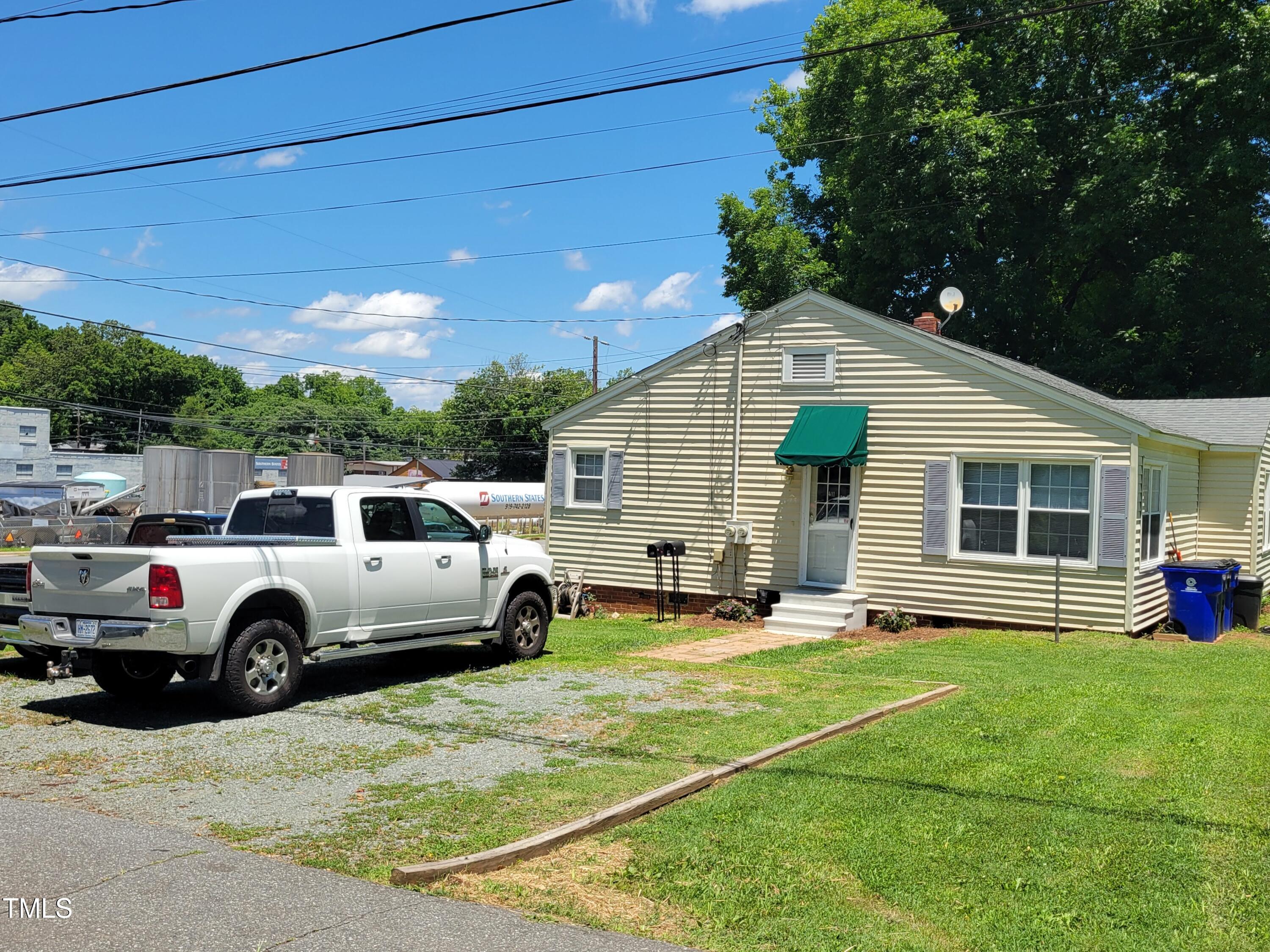 411 West Raleigh Street Siler City, NC 27344 - Photo 28 of 33 a front view of a house with a yard