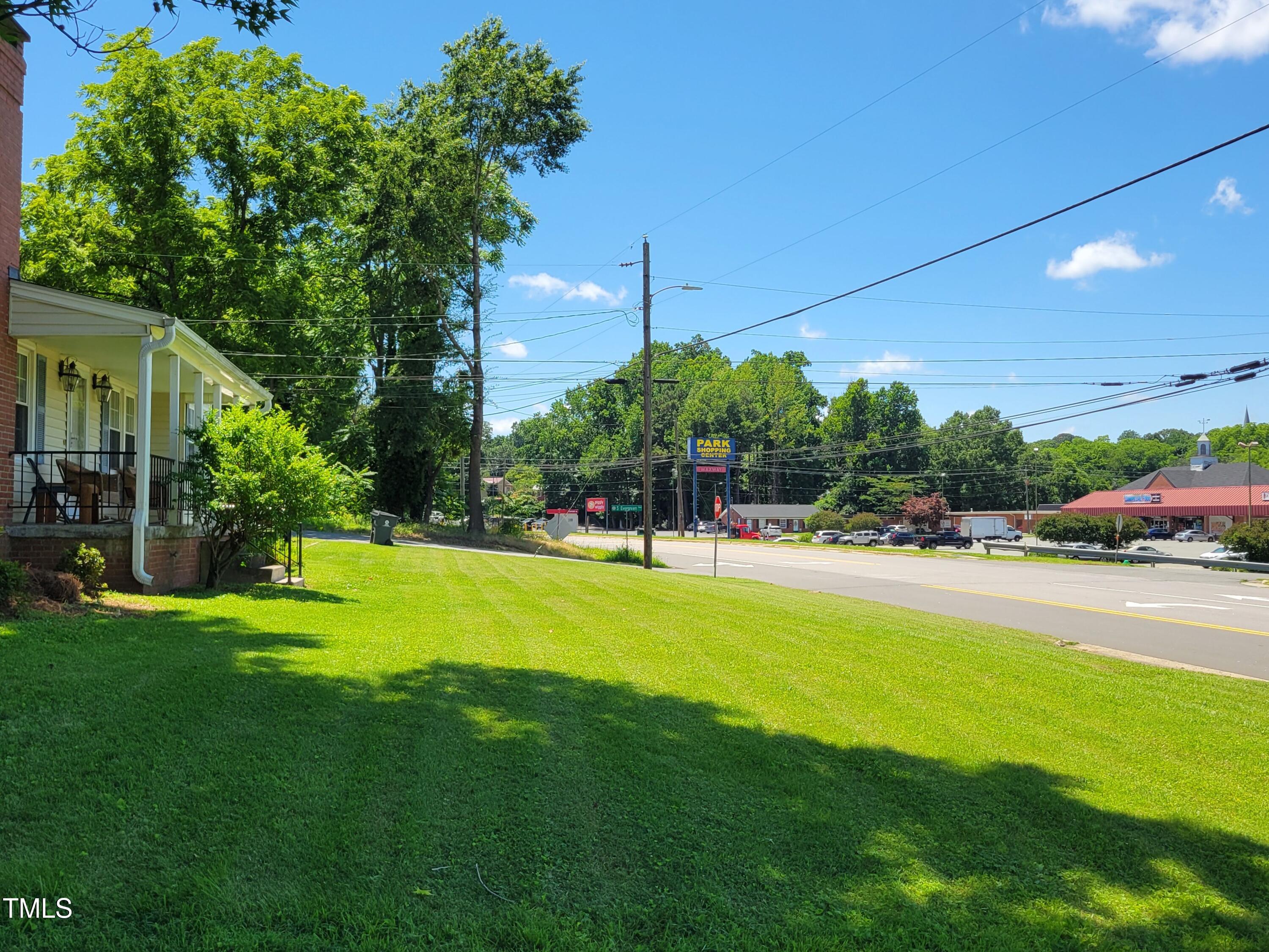 411 West Raleigh Street Siler City, NC 27344 - Photo 30 of 33 a view of a house with a backyard porch and sitting area