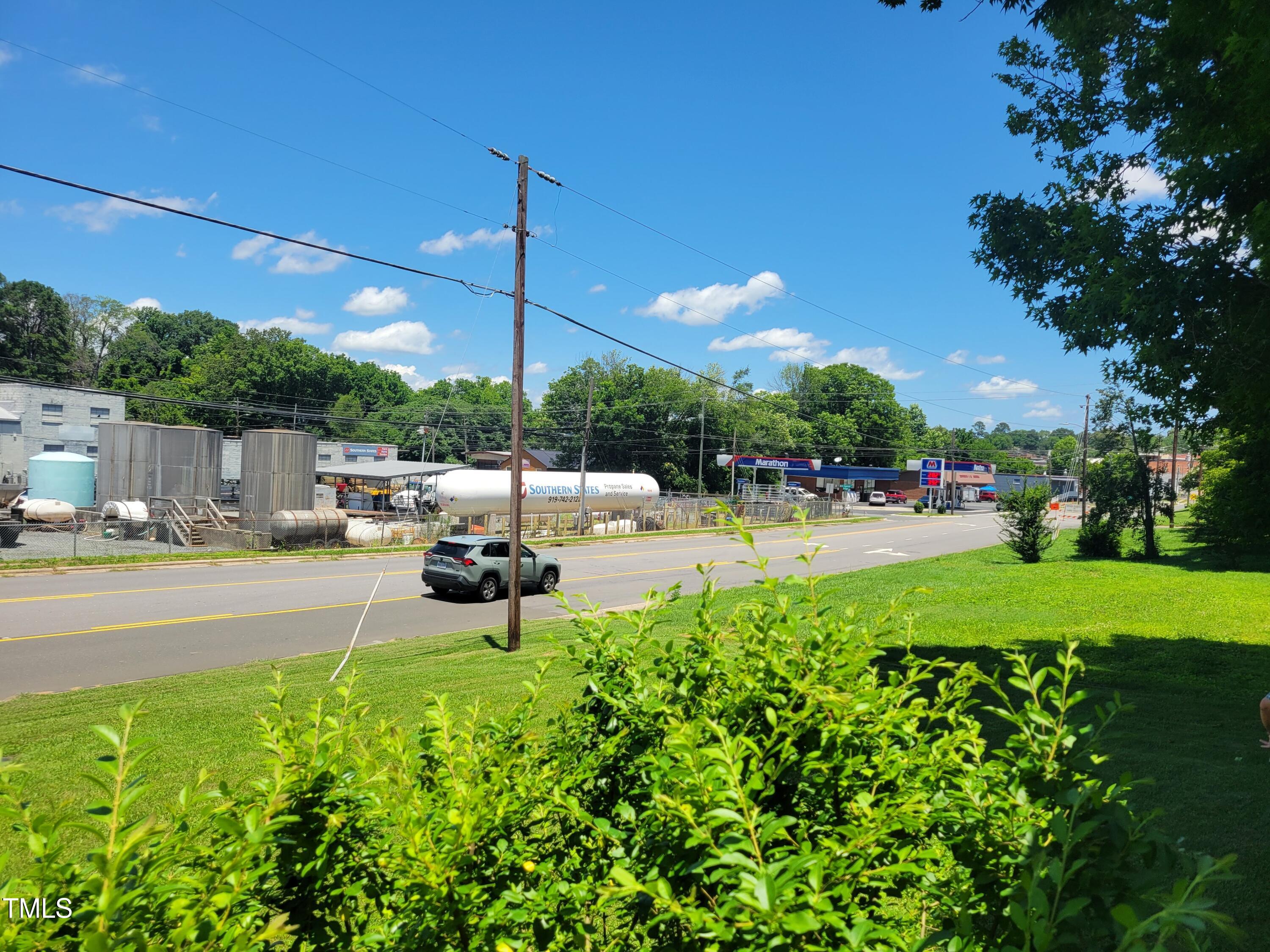 411 West Raleigh Street Siler City, NC 27344 - Photo 32 of 33 a swimming pool with outdoor seating and yard