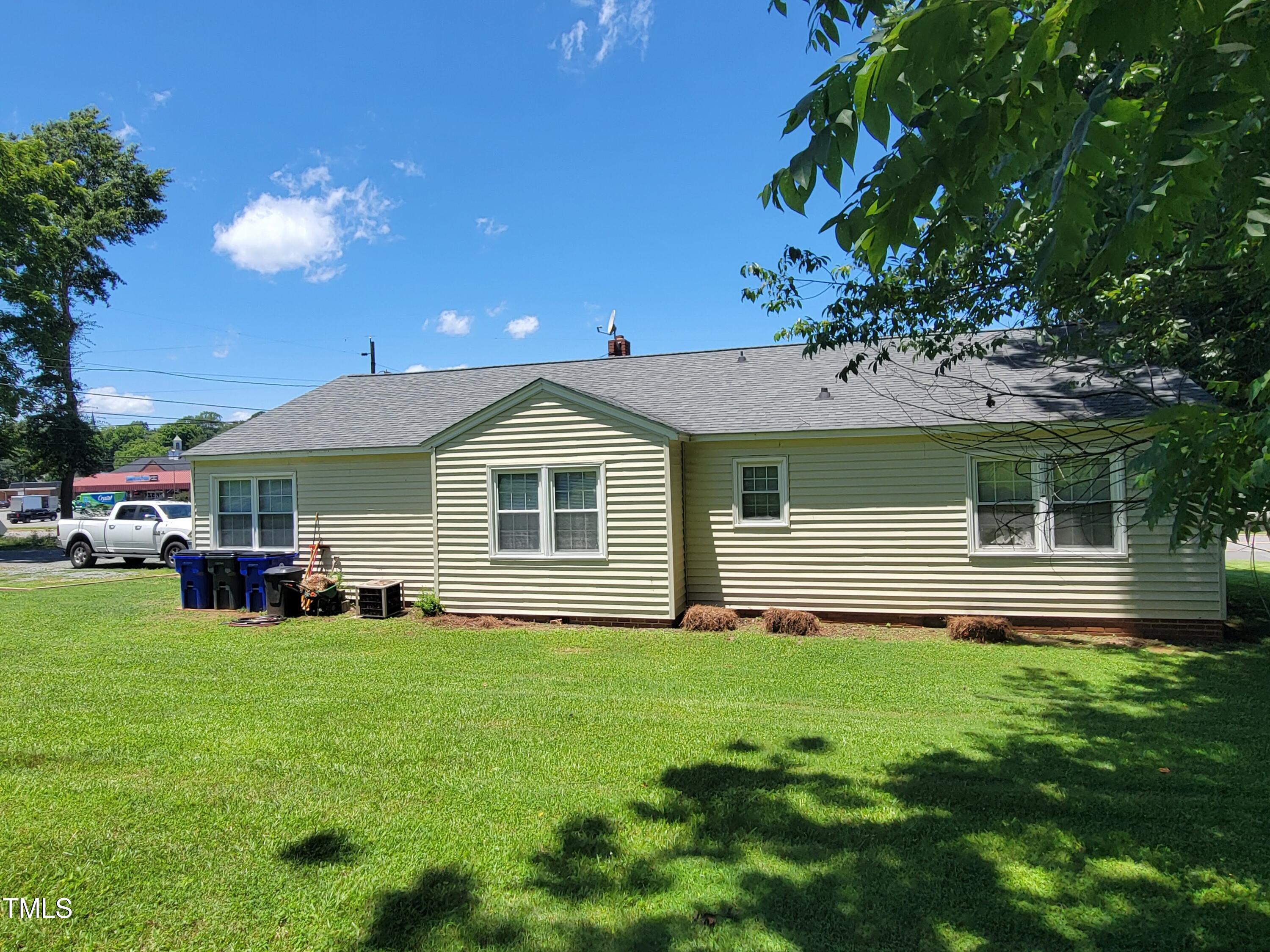 411 West Raleigh Street Siler City, NC 27344 - Photo 4 of 33 a front view of house with yard and green space