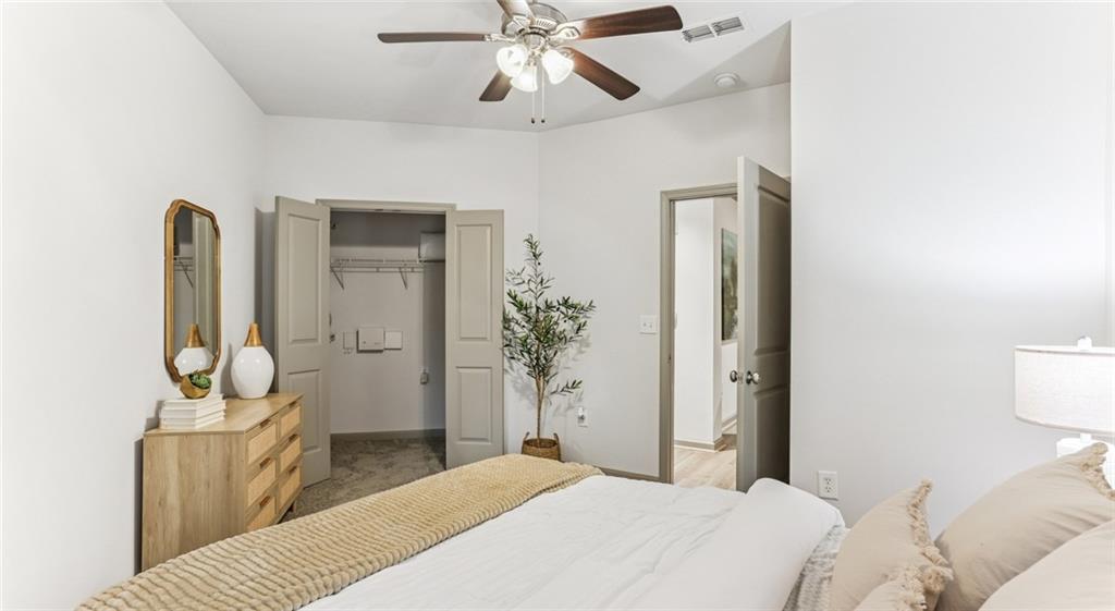 2910 Clairmont Road, Unit PLAN 5 Atlanta, GA 30329 - Photo 26 of 29 a bedroom with a bed and a chandelier