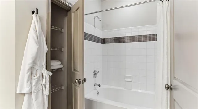 a bathroom with a bathtub and a shower