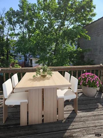 a view of a patio with table and chairs and potted plants