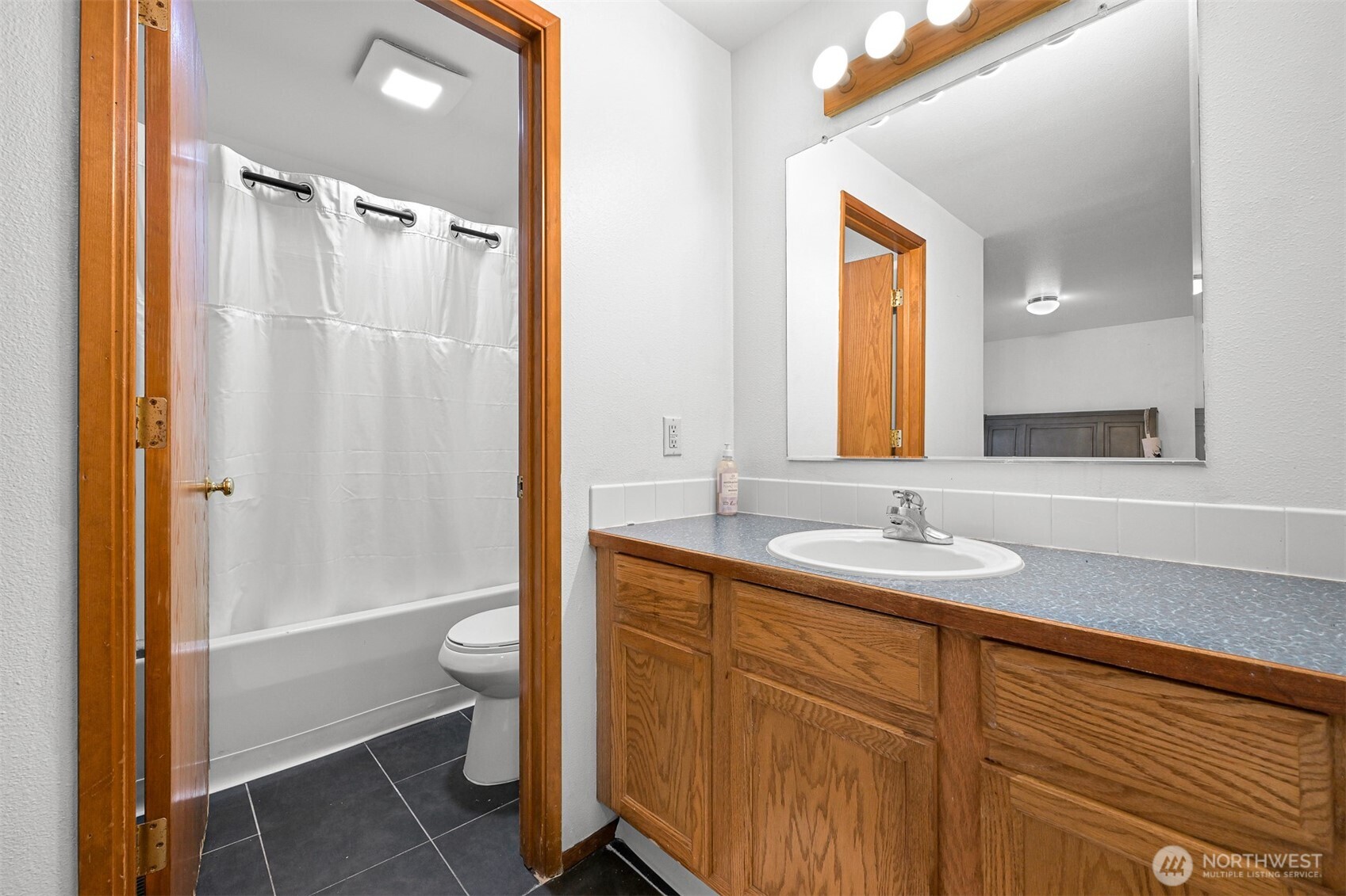5315 Shields Road Ferndale, WA 98248 - Photo 19 of 36 a bathroom with a granite countertop sink toilet and shower