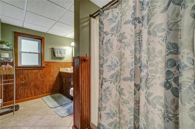 a bathroom with a shower and a sink