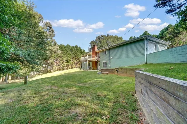 a backyard of a house with lots of green space
