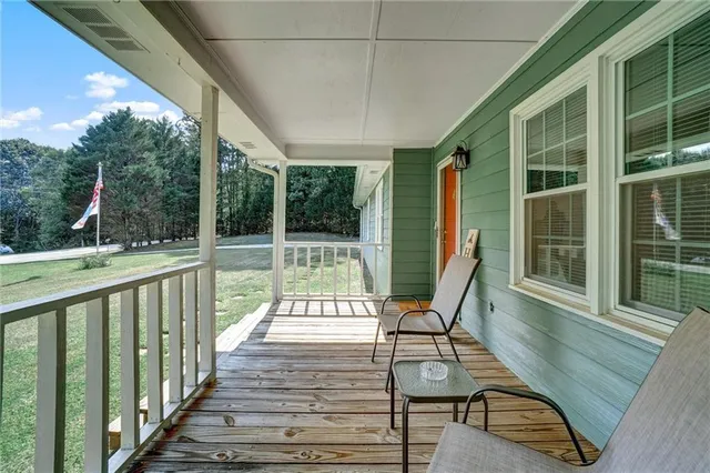 a view of a chairs and tables in the balcony