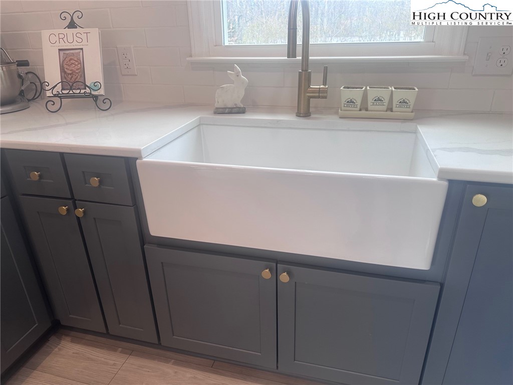 410 Cook Street Jefferson, NC 28640 - Photo 7 of 16 a bathroom with a sink and a bathtub