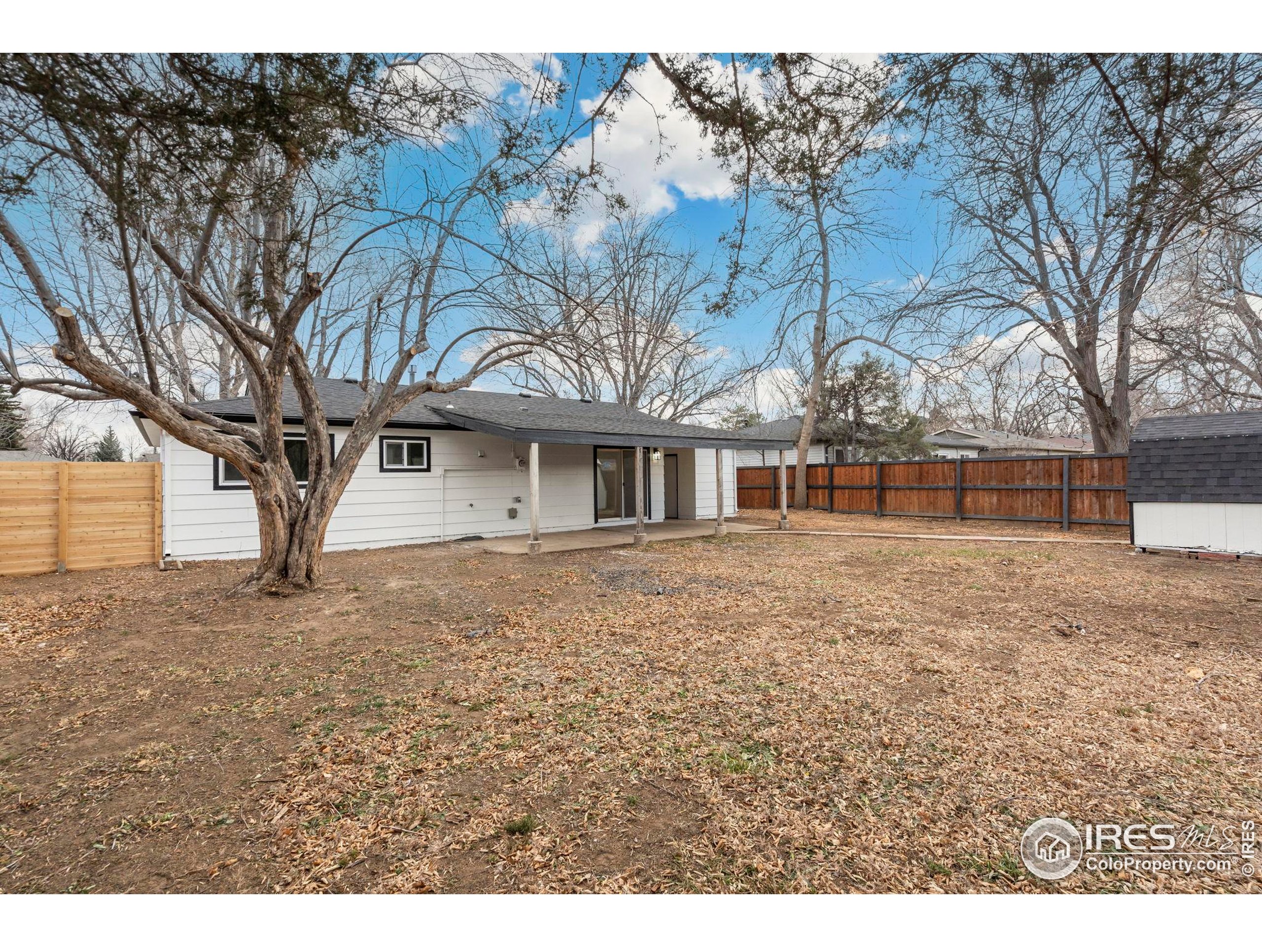 409 Franklin Street Fort Collins, CO 80521 - Photo 21 of 24 a front view of a house with a garden