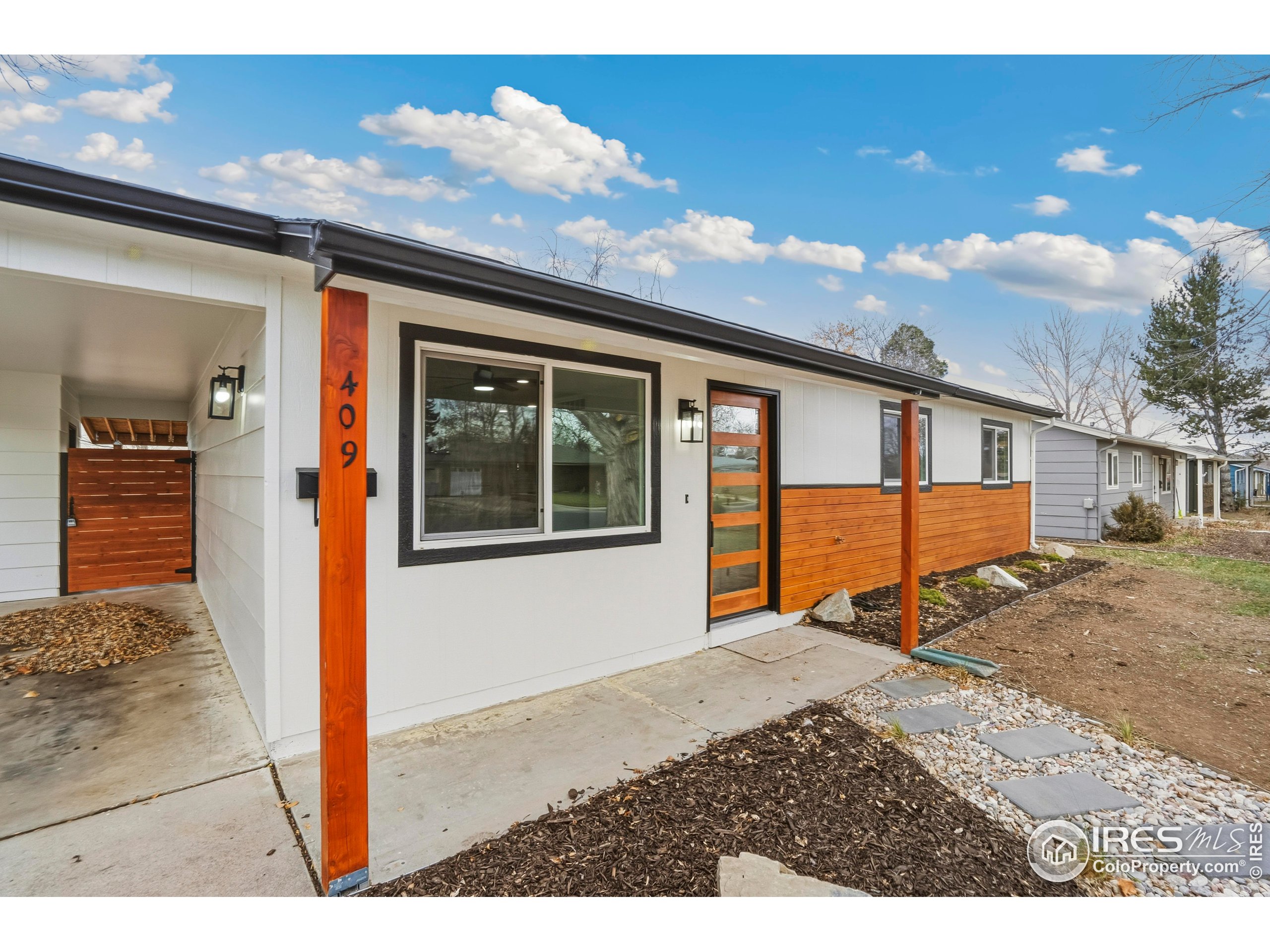 409 Franklin Street Fort Collins, CO 80521 - Photo 4 of 24 a front view of a house with a yard