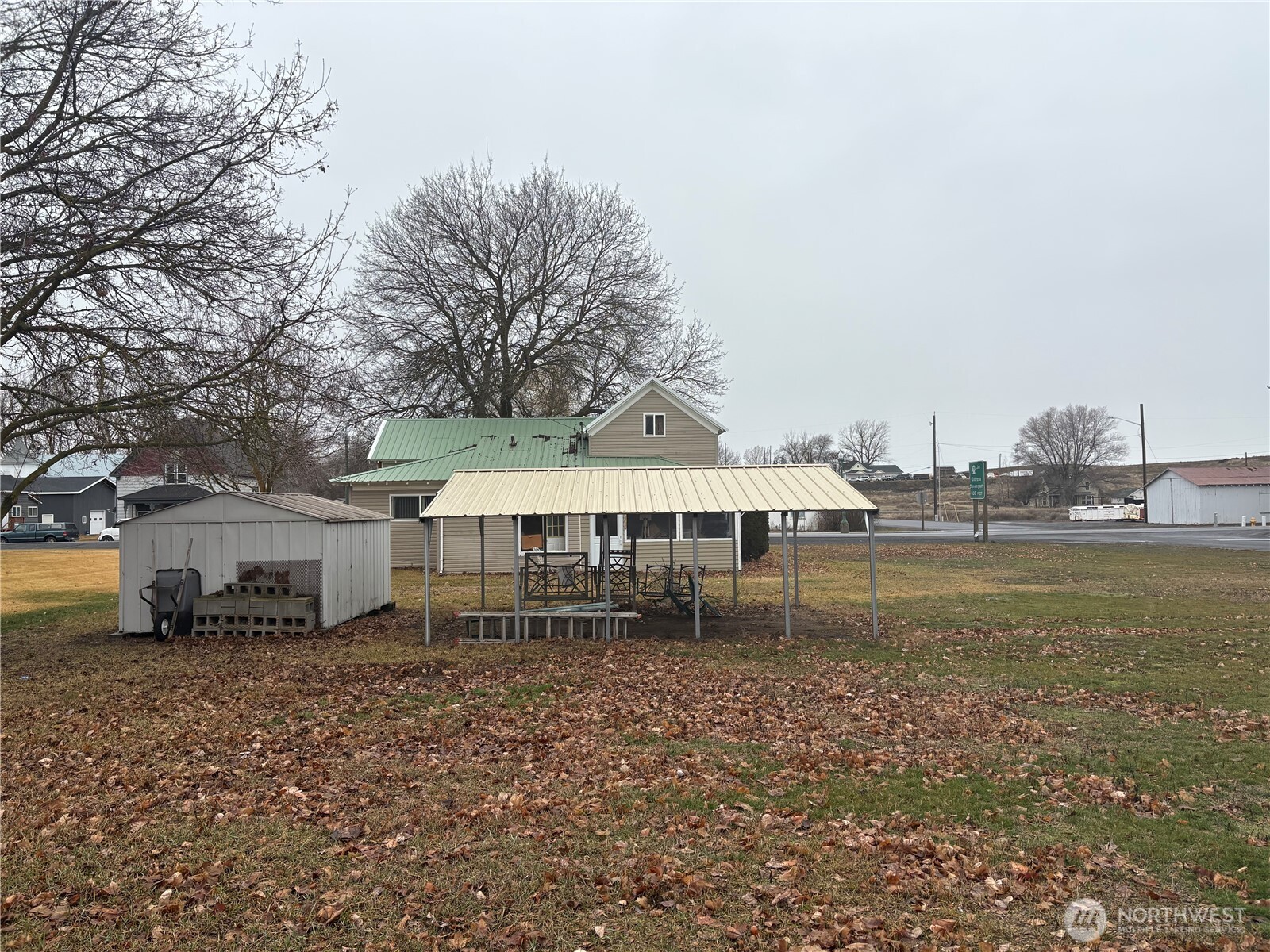 208 North 3rd Street Harrington, WA 99134 - Photo 7 of 16 a view of a house with a yard and sitting area