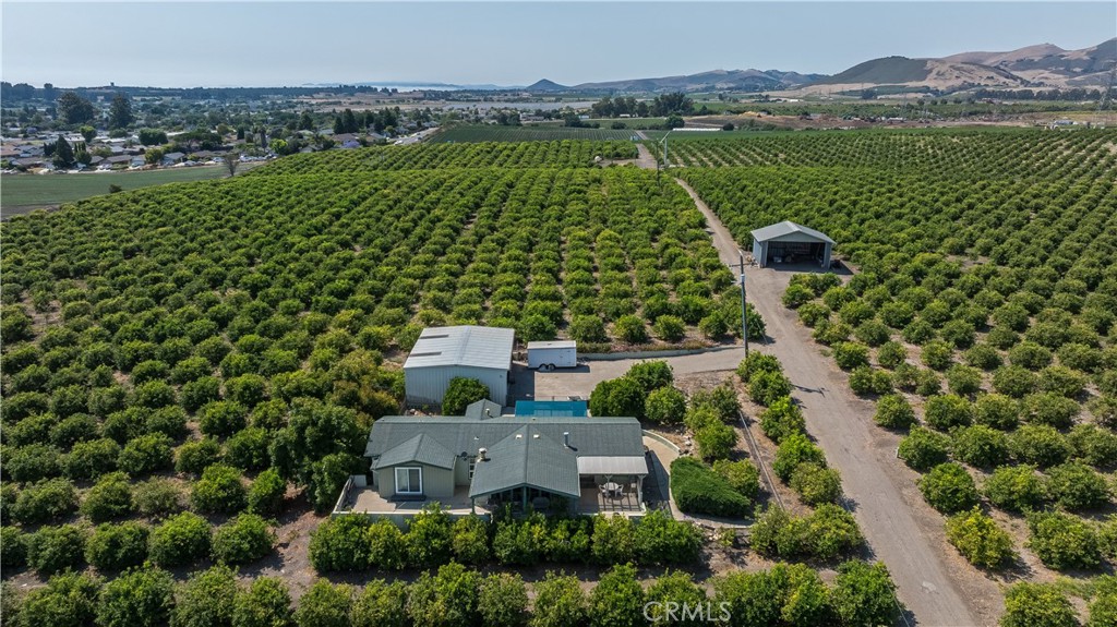 215 Rancho Road Nipomo, CA 93444 - Photo 2 of 6 an aerial view of a house with a garden and lake view