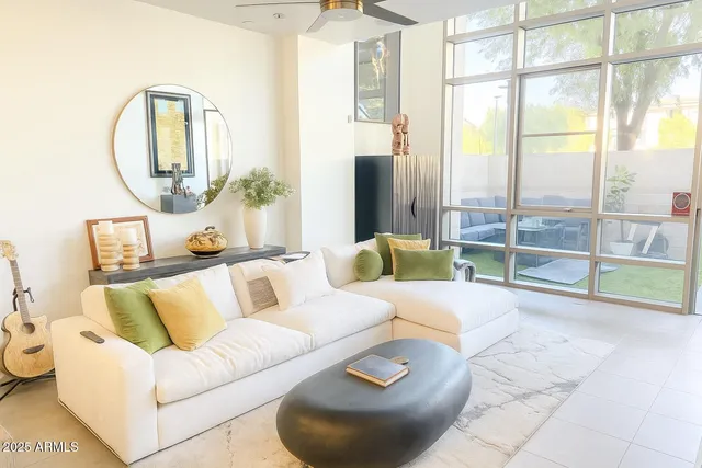 a living room with furniture and a large window