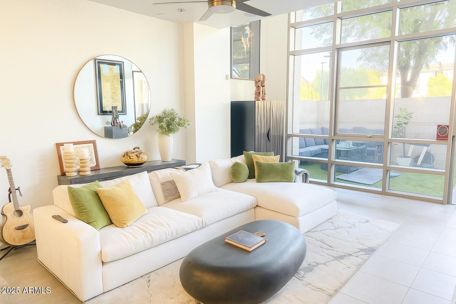 a living room with furniture and a large window