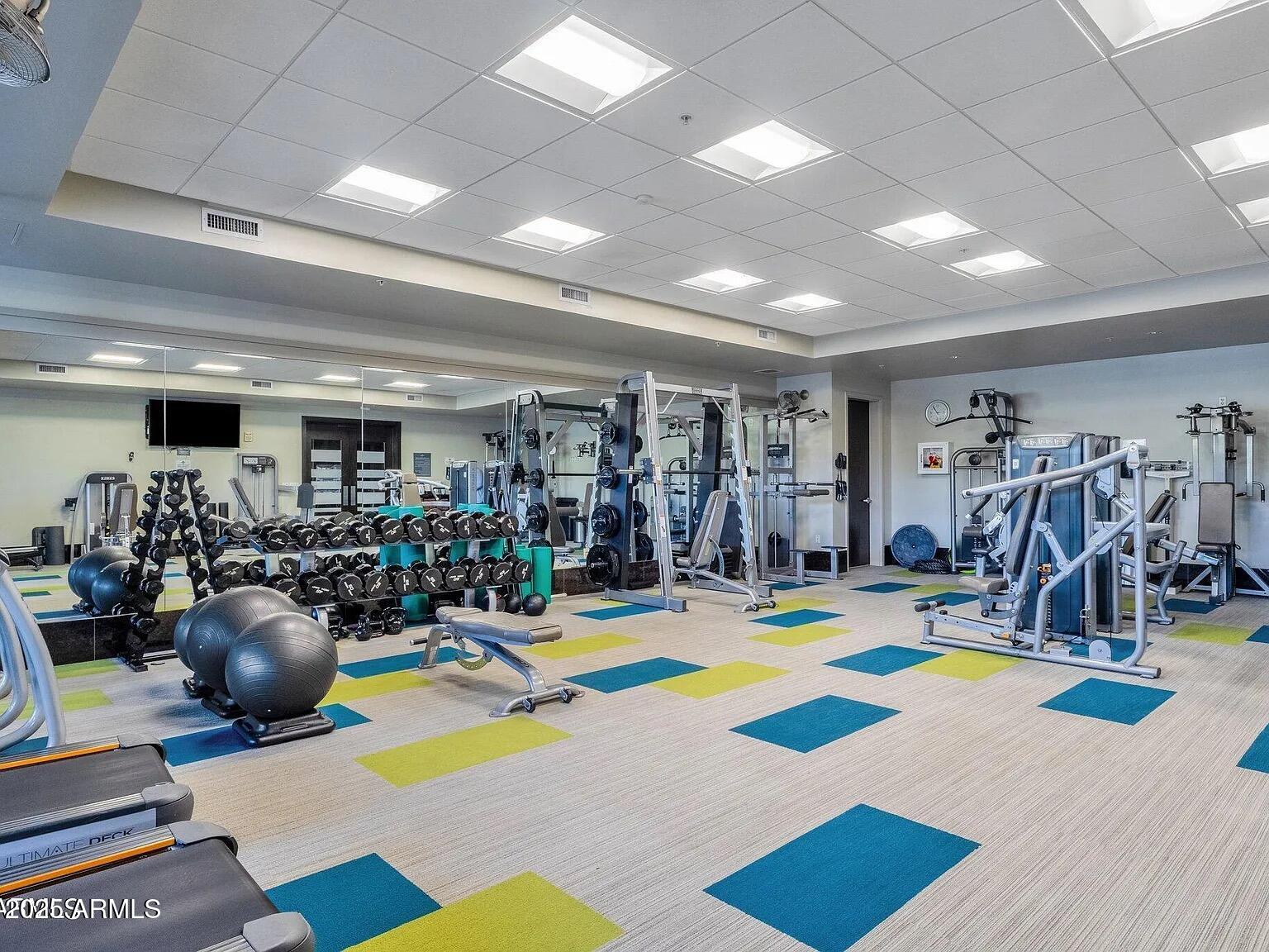 15215 North Kierland Boulevard, Unit 103 Scottsdale, AZ 85254 - Photo 11 of 20 a view of a room with gym equipment