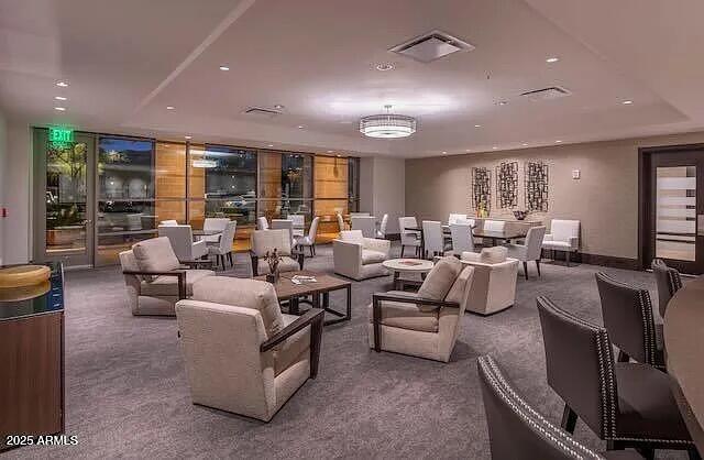 15215 North Kierland Boulevard, Unit 103 Scottsdale, AZ 85254 - Photo 13 of 20 a living room with furniture and a large window