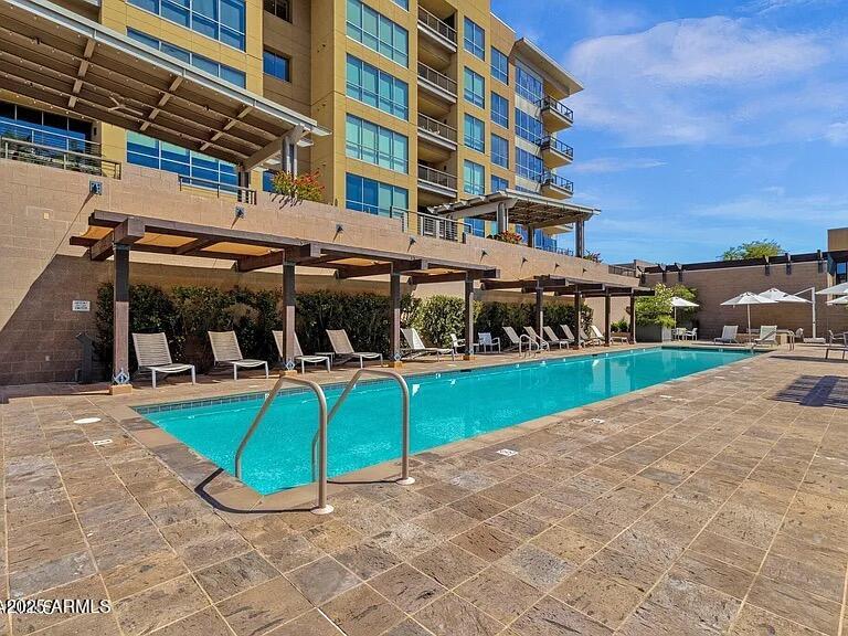 15215 North Kierland Boulevard, Unit 103 Scottsdale, AZ 85254 - Photo 14 of 20 a view of a swimming pool with a patio