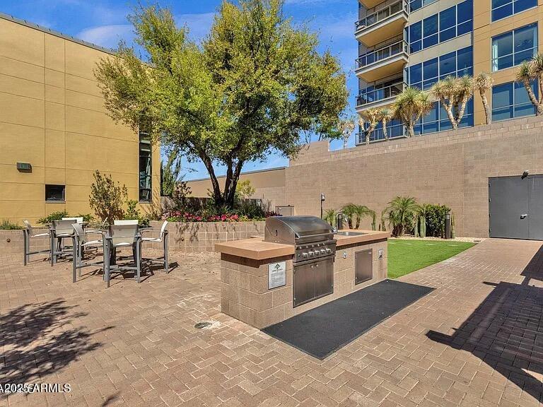 15215 North Kierland Boulevard, Unit 103 Scottsdale, AZ 85254 - Photo 16 of 20 a view of a patio with table and chairs