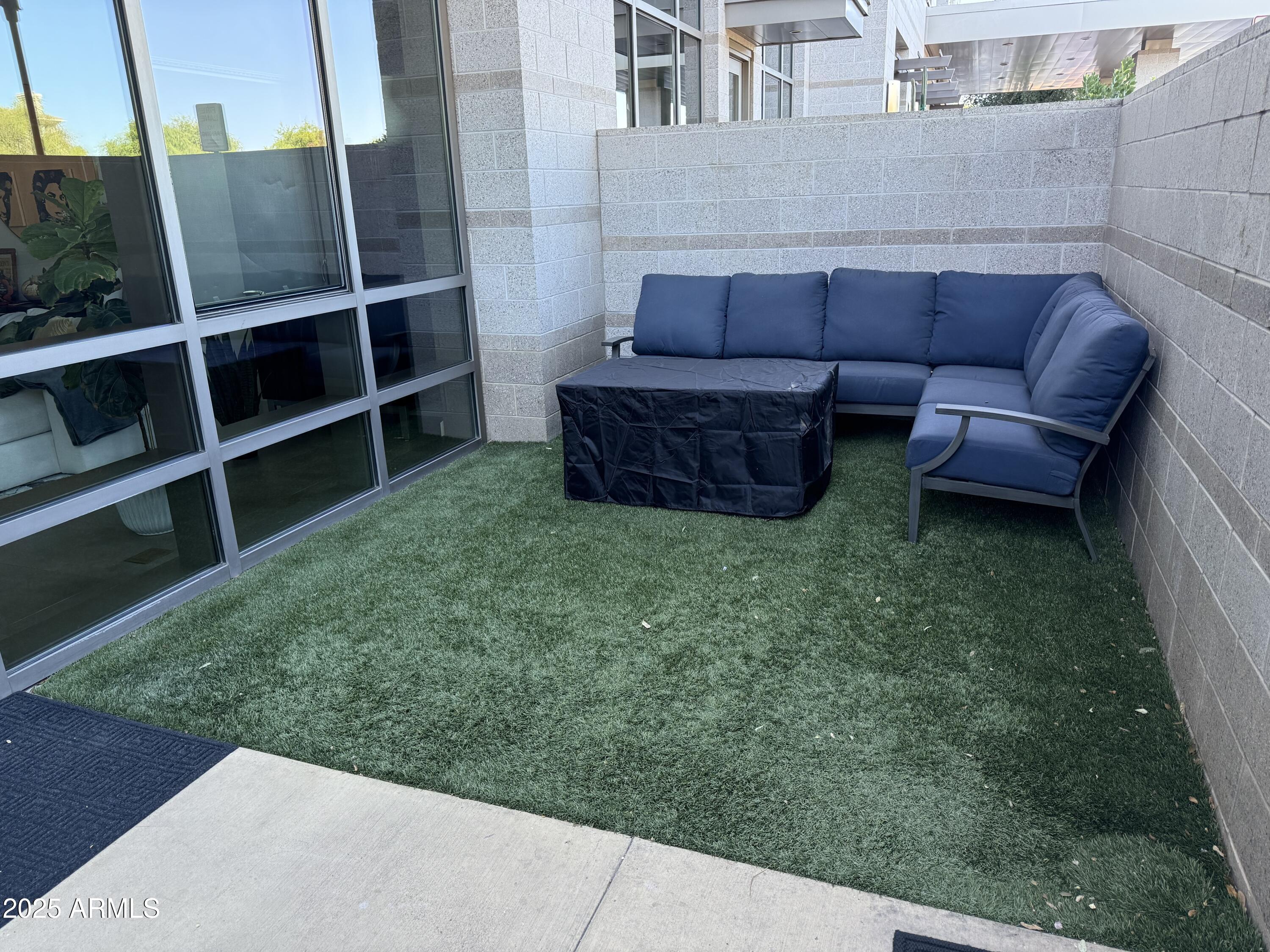 15215 North Kierland Boulevard, Unit 103 Scottsdale, AZ 85254 - Photo 10 of 20 a view of a backyard with couches and pool