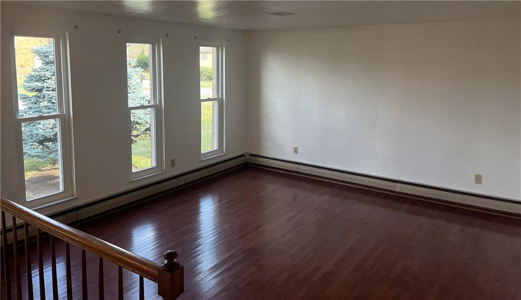 7 Fieldcrest Drive Cecil, PA 15321 - Photo 2 of 15 a view of an empty room with wooden floor and a window