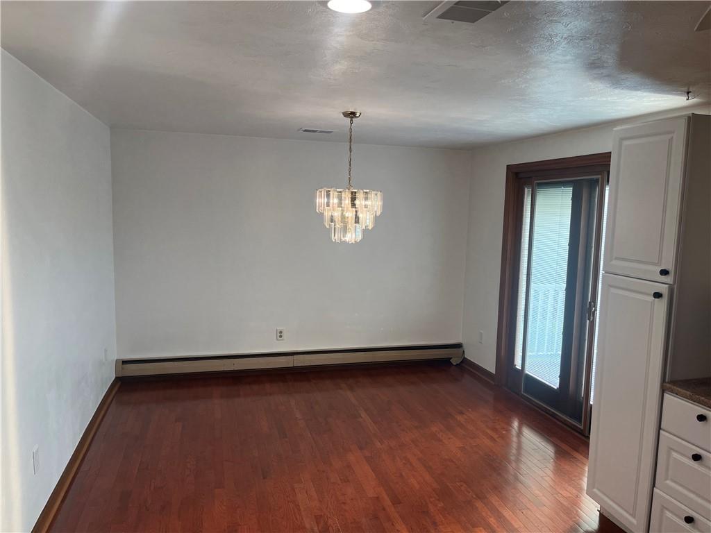 7 Fieldcrest Drive Cecil, PA 15321 - Photo 5 of 15 an empty room with wooden floor and windows