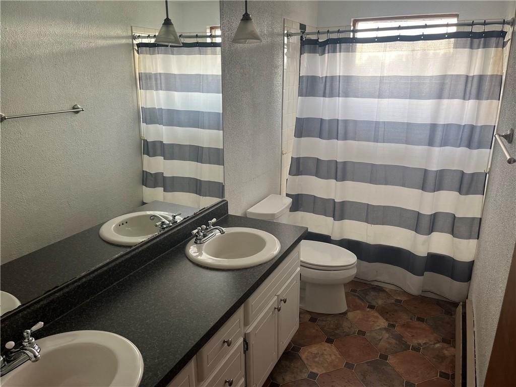 7 Fieldcrest Drive Cecil, PA 15321 - Photo 6 of 15 a bathroom with a granite countertop sink toilet a mirror and shower