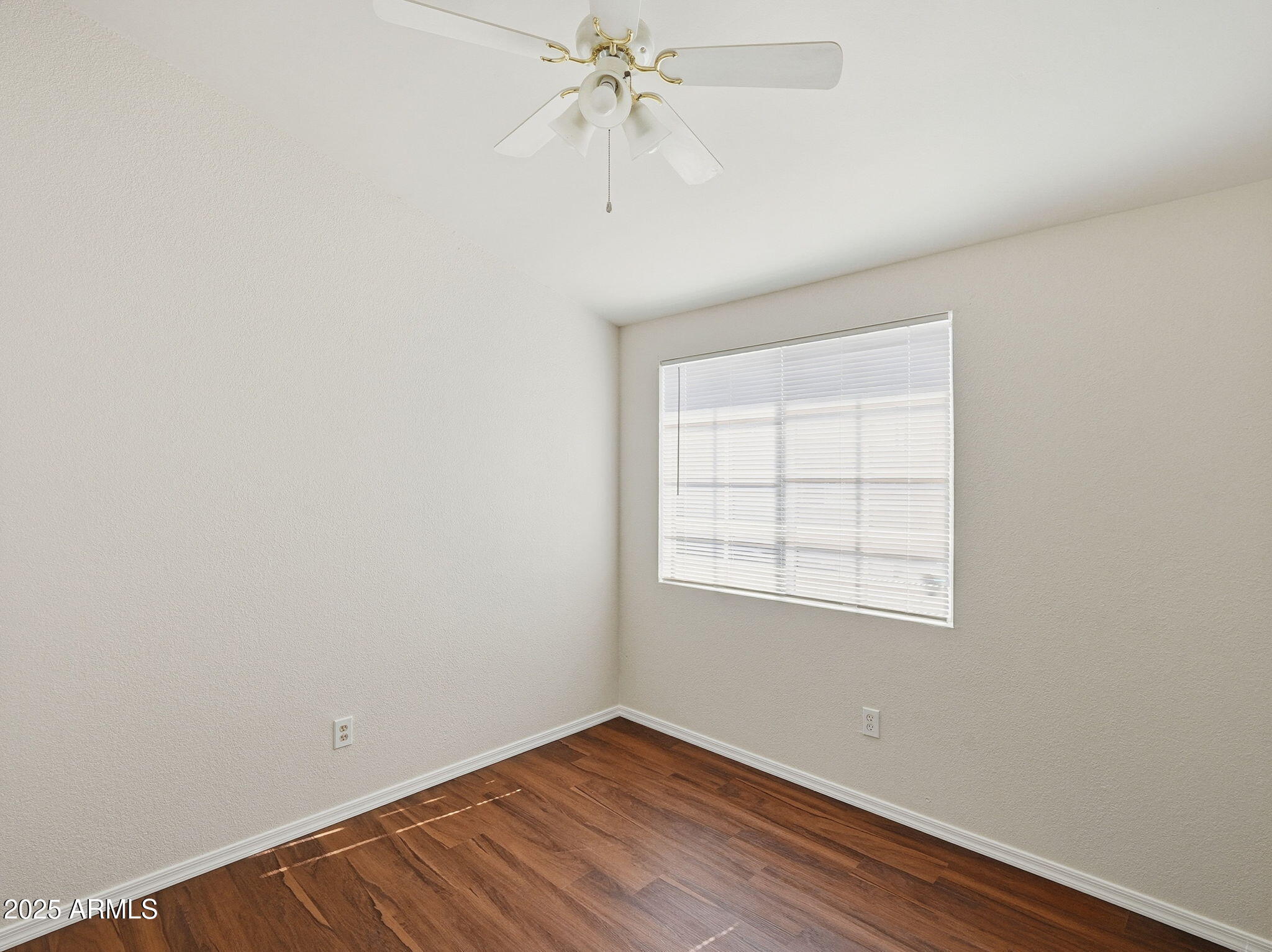 510 North Alma School Road, Unit 223 Mesa, AZ 85201 - Photo 13 of 25 an empty room with a window and a fan