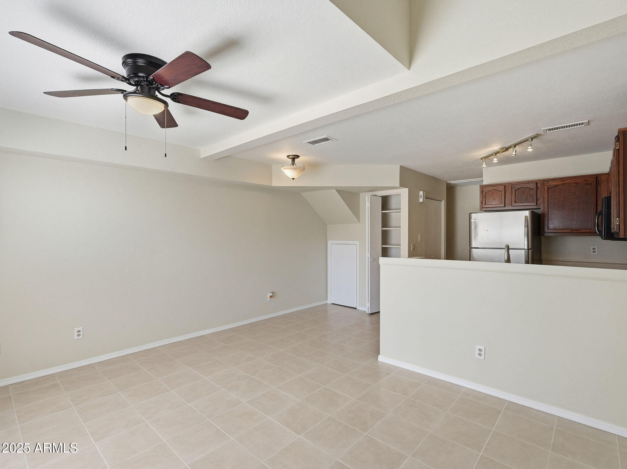510 North Alma School Road, Unit 223 Mesa, AZ 85201 - Photo 7 of 25 a view of an empty room with a ceiling fan