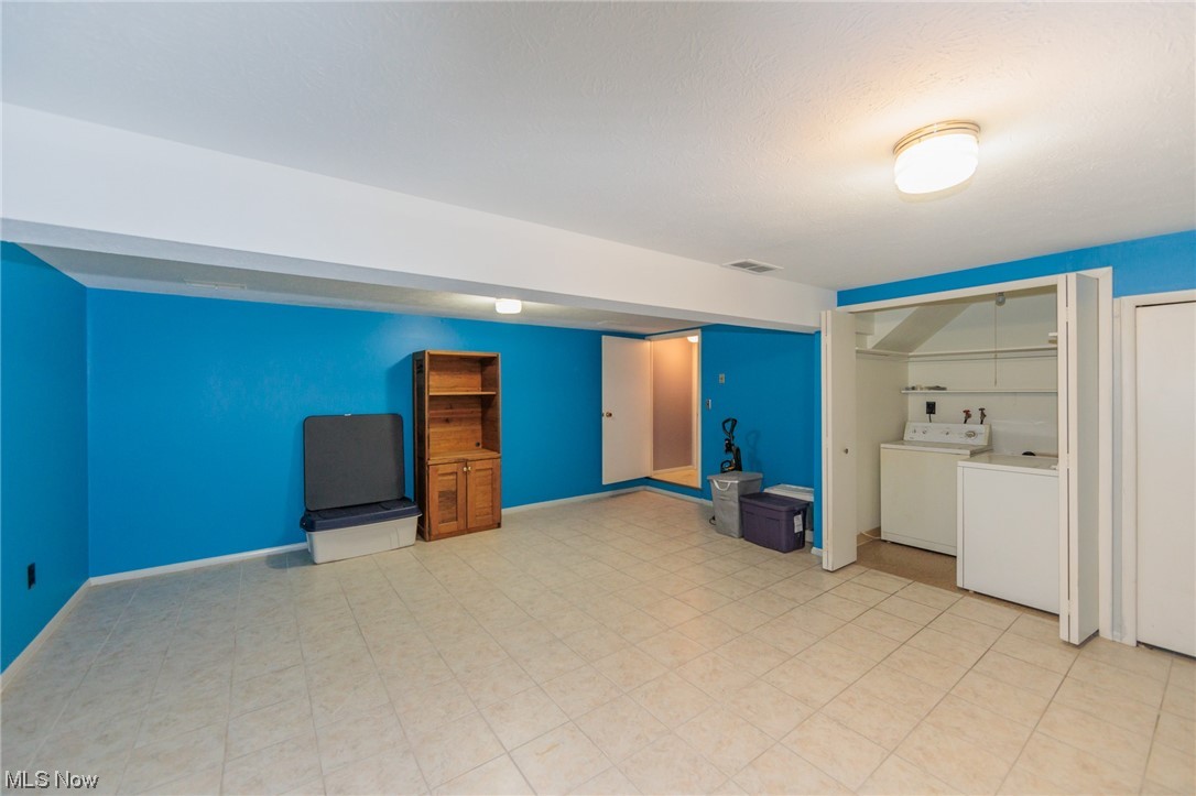 6472 State Road, Unit J19 Parma, OH 44134 - Photo 33 of 33 Basement with independent washer and dryer and light tile floors