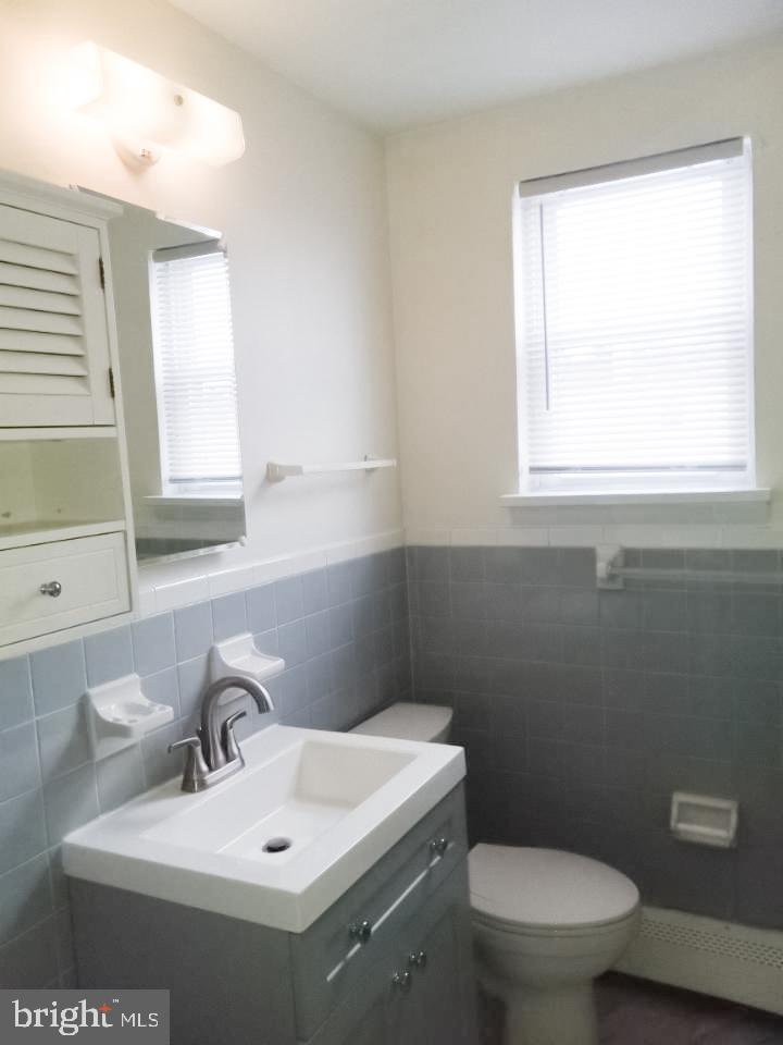 901 East Pleasant Avenue Glenside, PA 19038 - Photo 3 of 7 a bathroom with a toilet sink and mirror