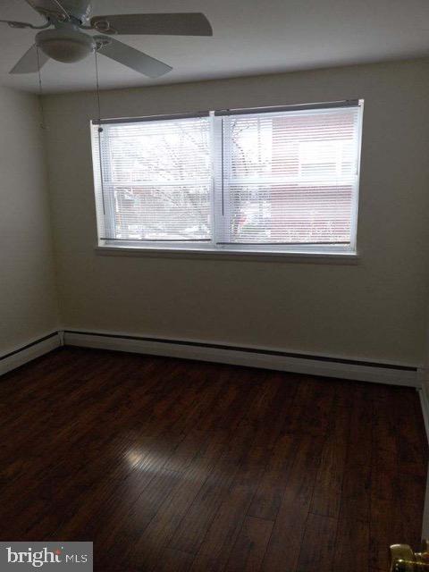 901 East Pleasant Avenue Glenside, PA 19038 - Photo 4 of 7 a view of an empty room with wooden floor and a window