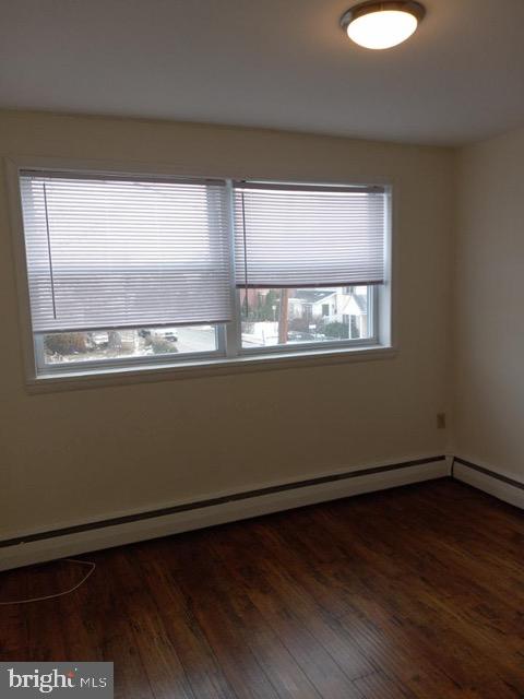 901 East Pleasant Avenue Glenside, PA 19038 - Photo 6 of 7 an empty room with wooden floor and windows
