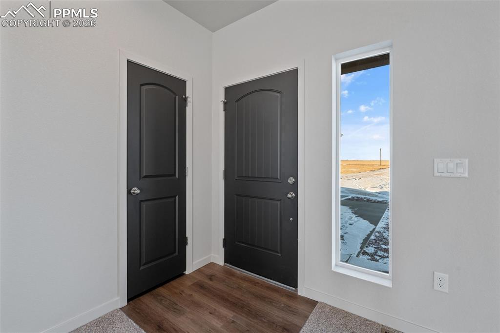 24615 Big Springs Road Calhan, CO 80808 - Photo 19 of 40 a view of an entryway with wooden floor