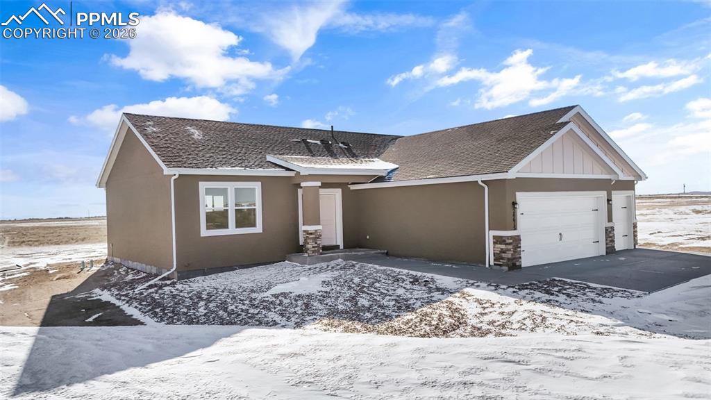 24615 Big Springs Road Calhan, CO 80808 - Photo 2 of 40 a view of a house with a patio