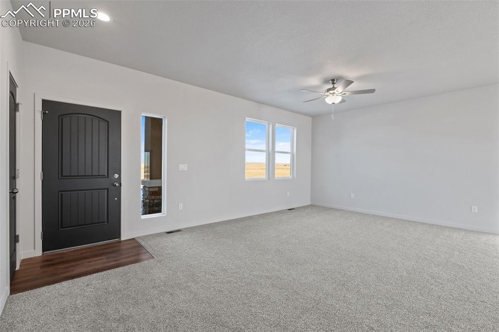 24615 Big Springs Road Calhan, CO 80808 - Photo 22 of 40 an empty room with windows and closet