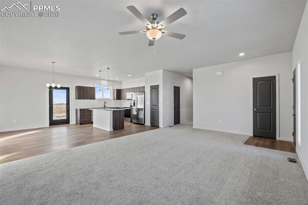 24615 Big Springs Road Calhan, CO 80808 - Photo 25 of 40 a view of a kitchen with a sink and a refrigerator