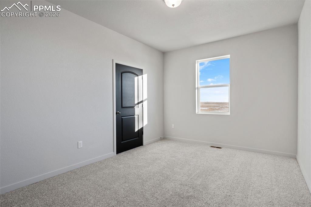 24615 Big Springs Road Calhan, CO 80808 - Photo 30 of 40 an empty room with windows