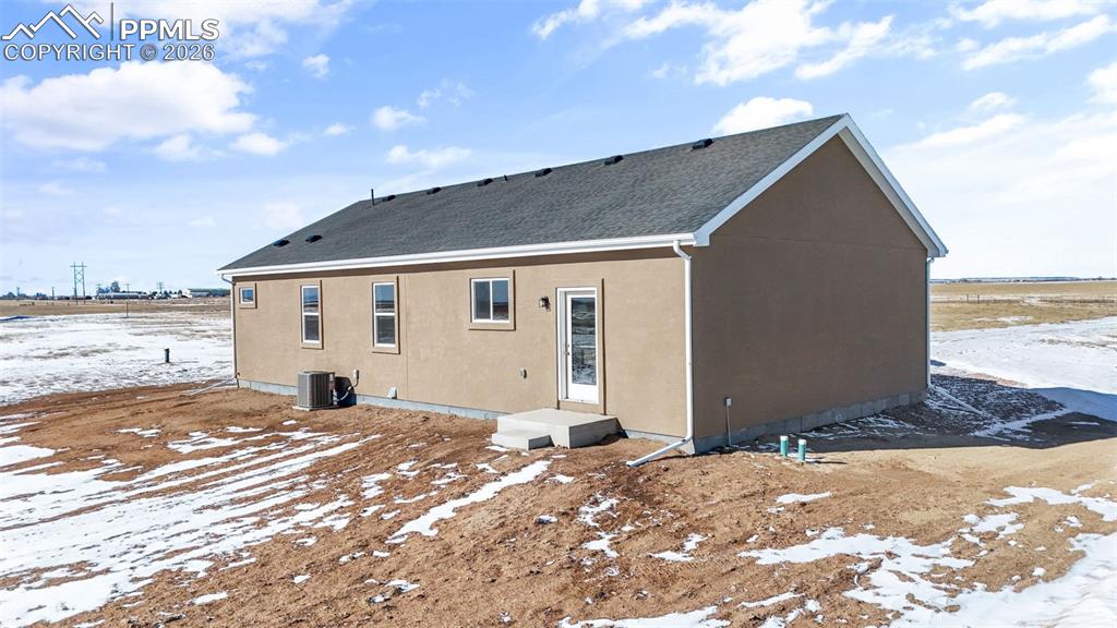 24615 Big Springs Road Calhan, CO 80808 - Photo 34 of 40 a view of a house with a yard