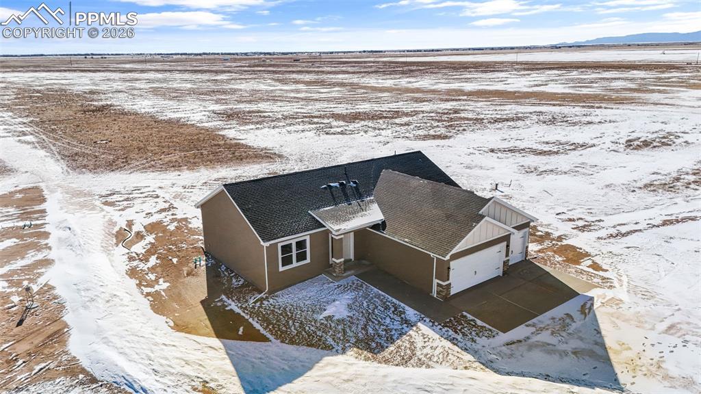 24615 Big Springs Road Calhan, CO 80808 - Photo 37 of 40 a living room with a flat screen tv and a rug