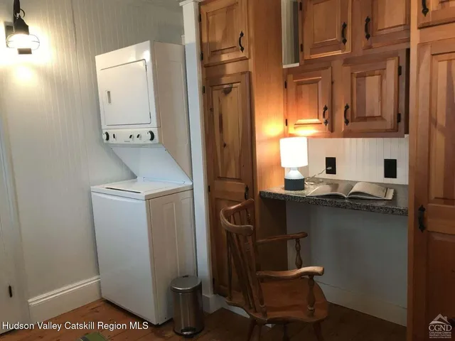 a bedroom with double bed and a window