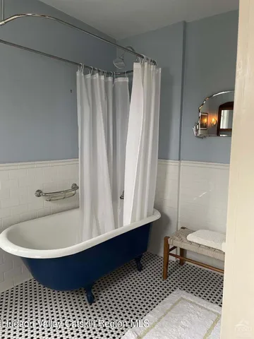 a bedroom with a bed and a desk