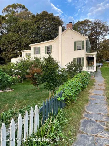 a view of a dining room with furniture and window