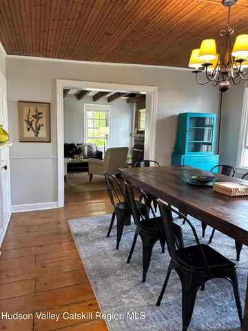 a spacious bedroom with a bed and a fireplace